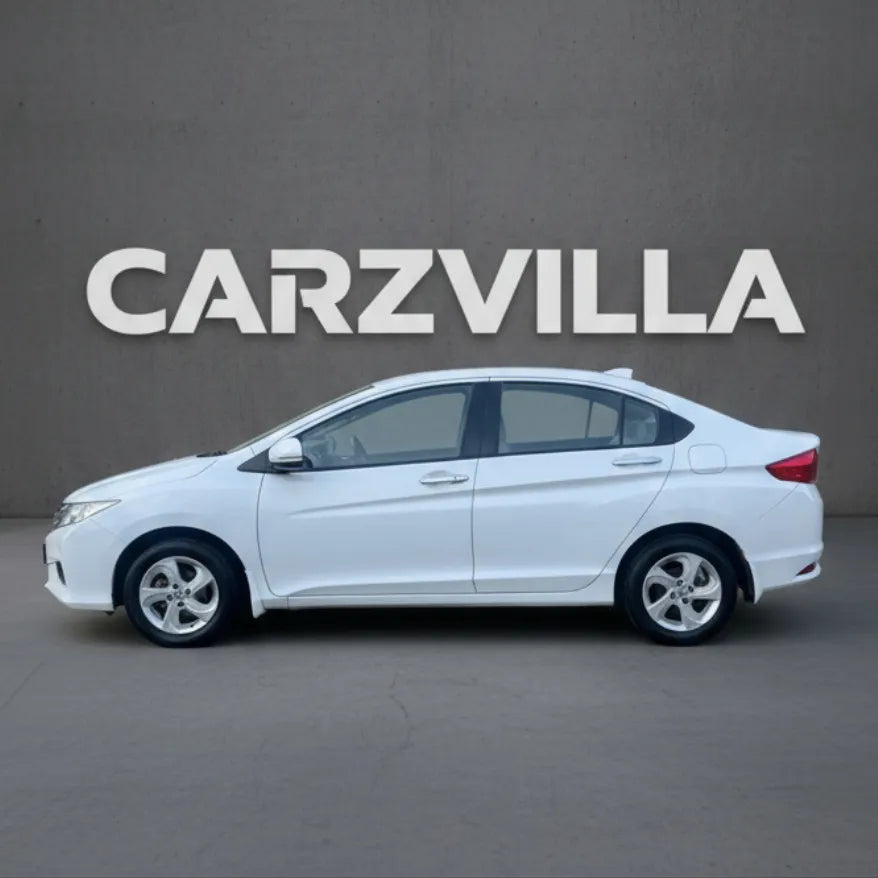 White car on a gray background with 'CARZVILLA' branding.