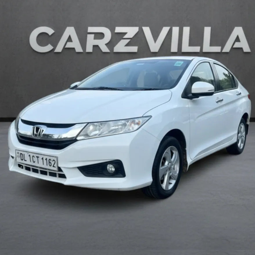 White Honda car on a gray background with 'CARZVILLA' branding.