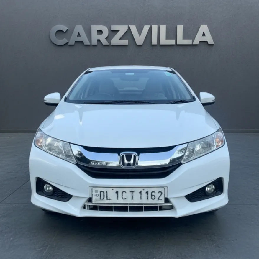 White Honda car with 'CARZVILLA' branding in the background