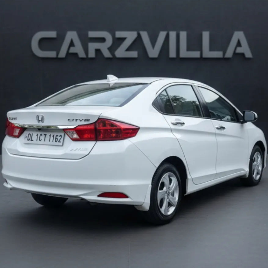 White Honda City car on a gray background with 'CARZVILLA' branding.