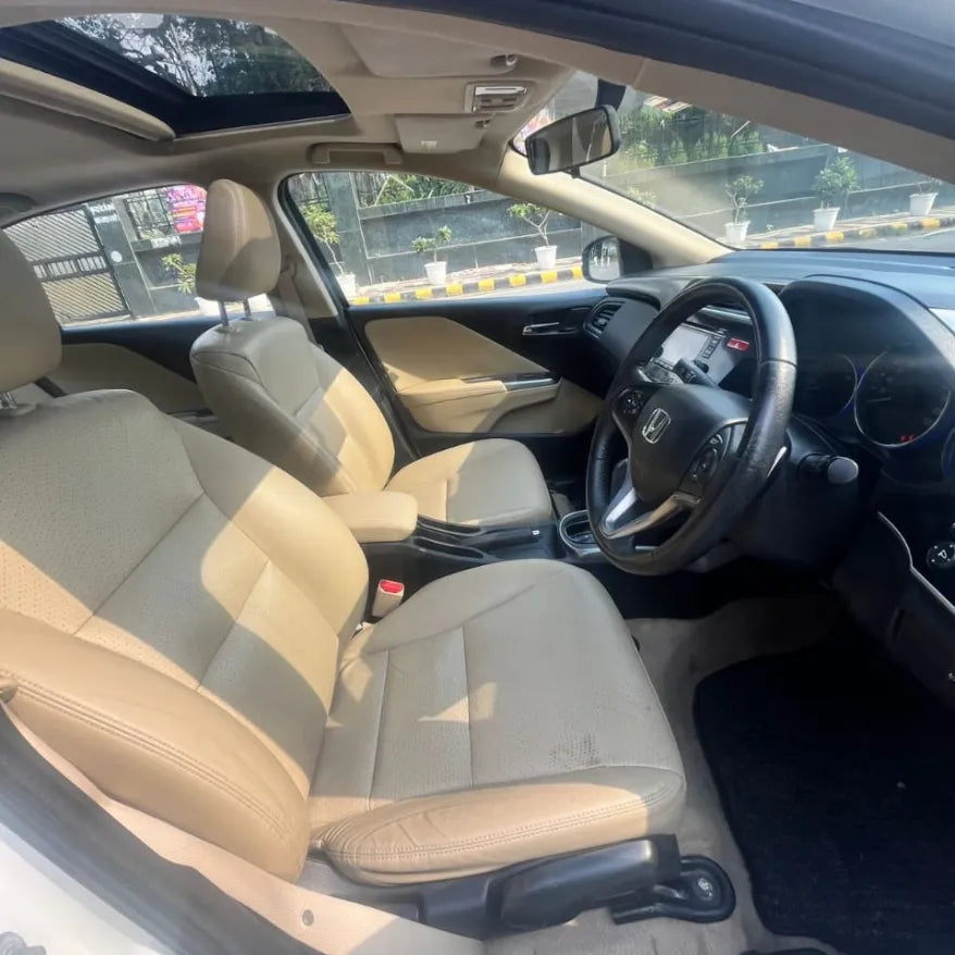 Car interior with beige seats and dashboard view