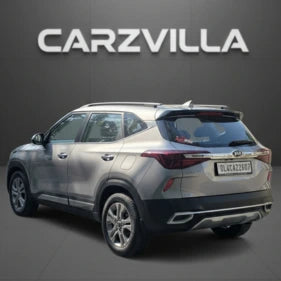 Silver SUV with CARZVILLA logo above on a dark background