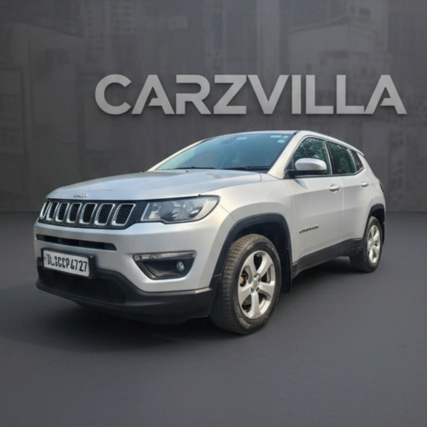 Silver SUV on a dark background with 'CARZVILLA' branding.