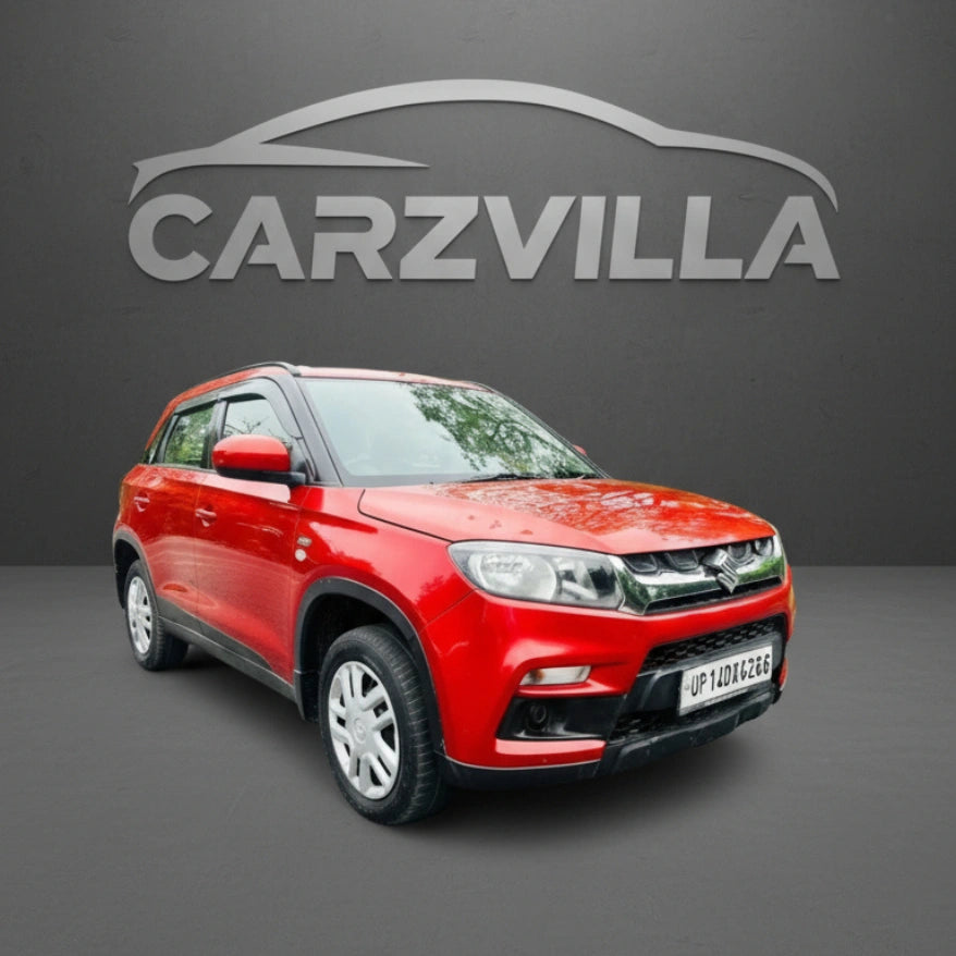 Red car on a gray background with 'CARZVILLA' logo above