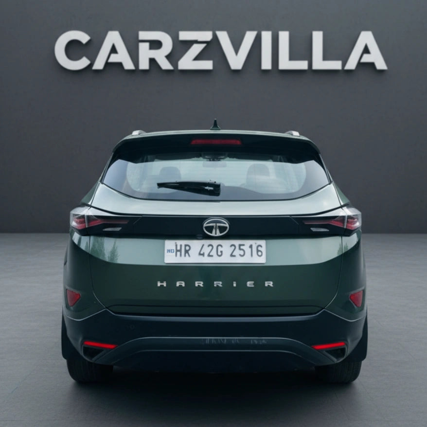 Green Tata Harrier SUV with 'CARZVILLA' branding on a gray background
