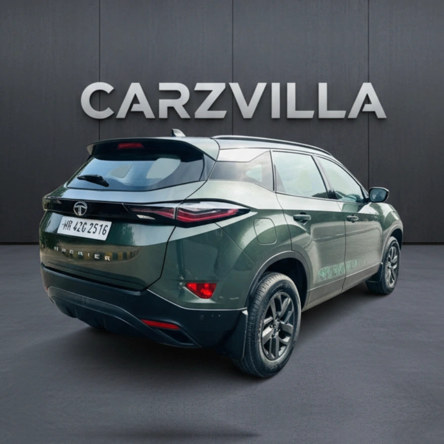 Green SUV with 'CARZVILLA' branding on a dark background