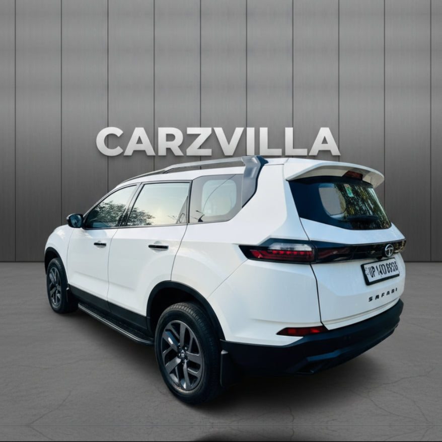 White SUV with 'CARZVILLA' branding on a gray background