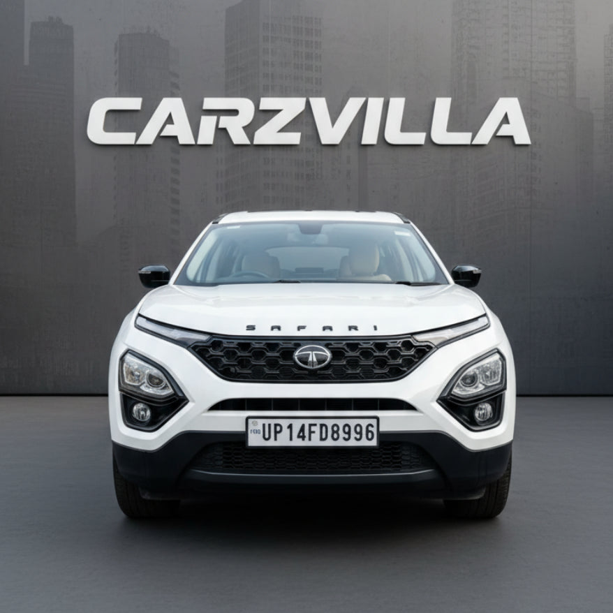 White SUV with 'CARZVILLA' branding against a cityscape background