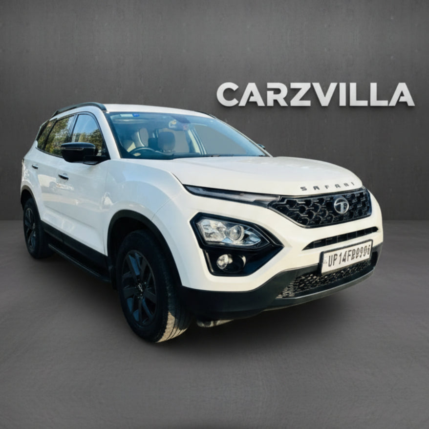 White SUV with black rims on a gray background, featuring the CARZVILLA logo.