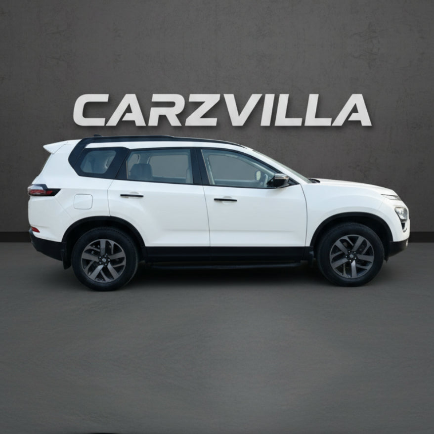 White SUV on a gray background with 'CARZVILLA' branding.