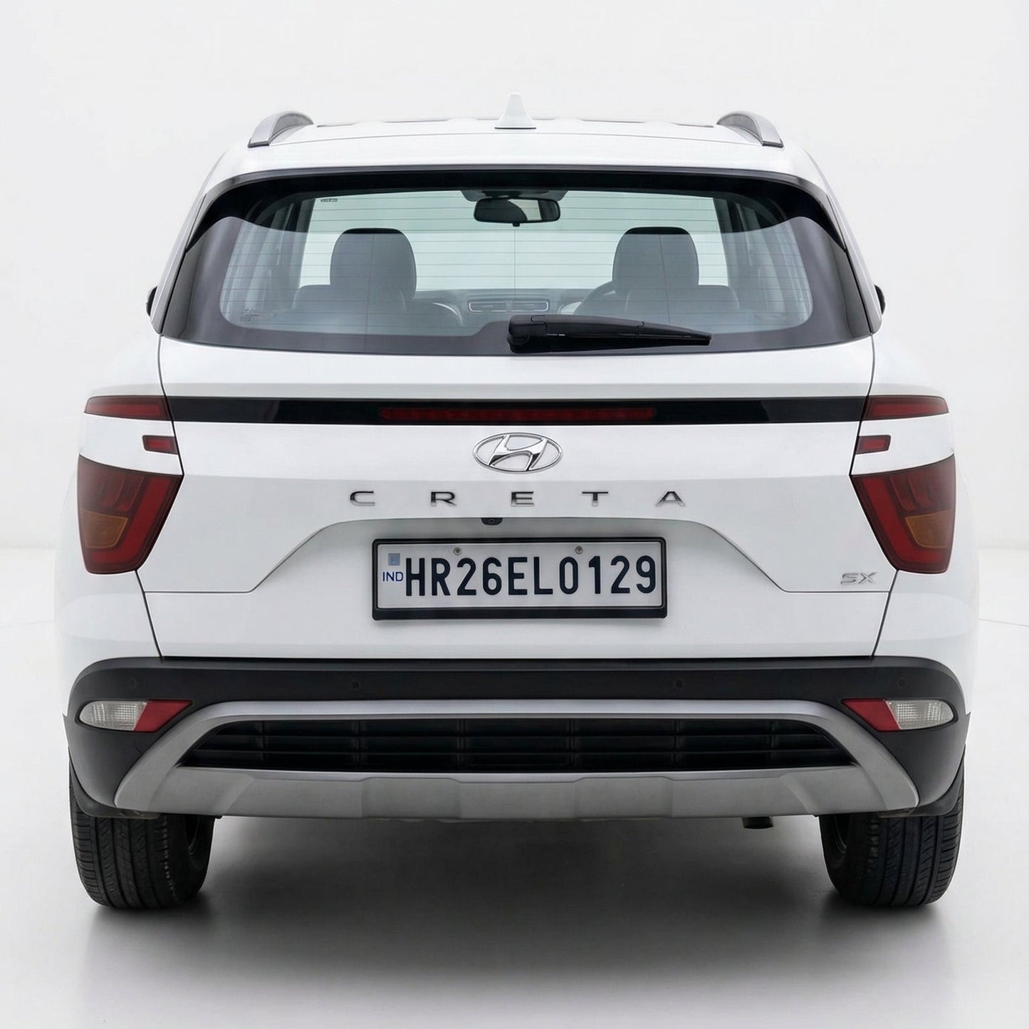 White Hyundai Creta SUV shown from the rear on a white background