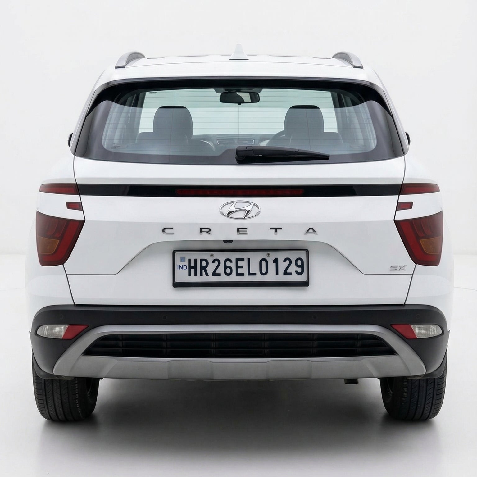 White Hyundai Creta SUV shown from the rear on a white background