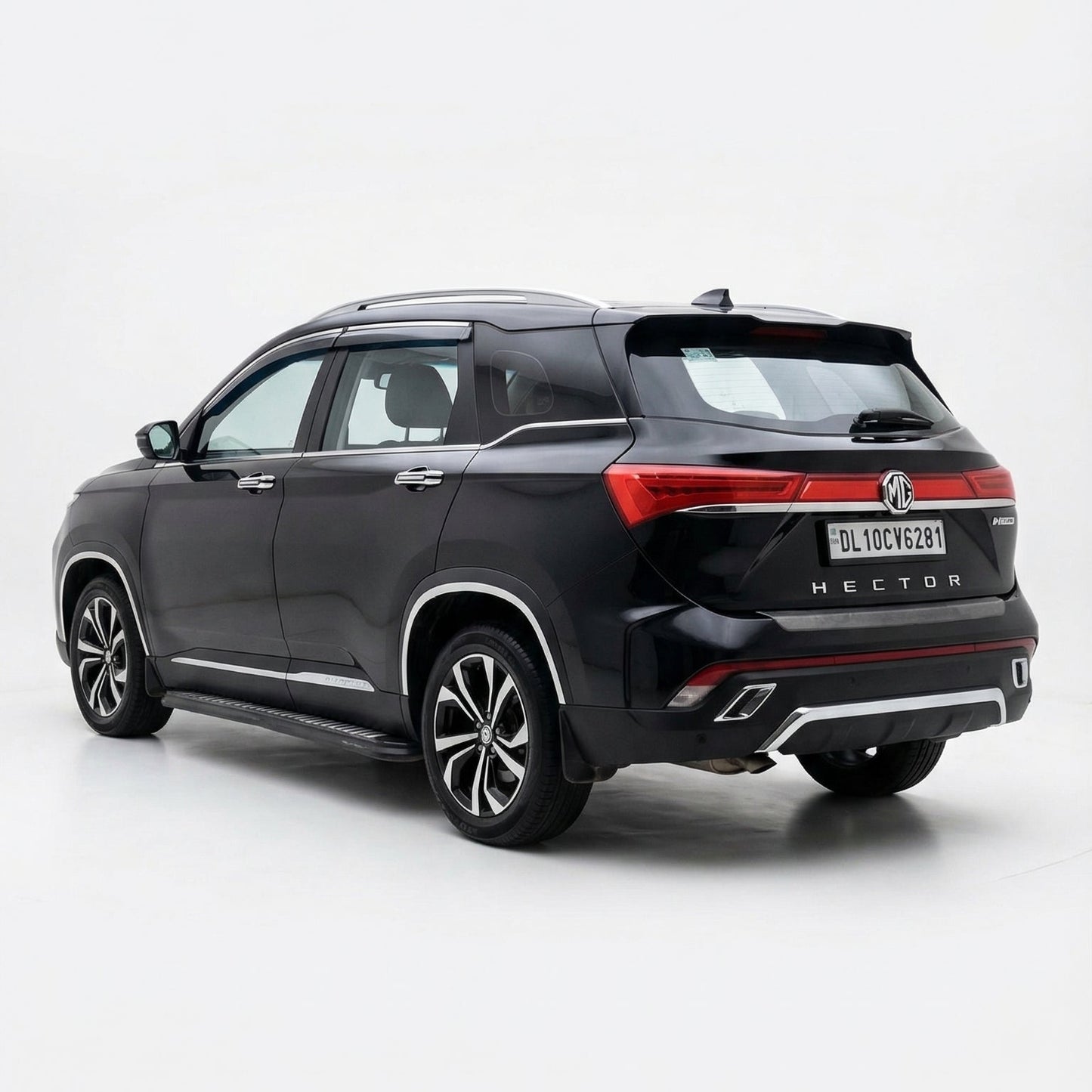 Black SUV with a red accent on a white background