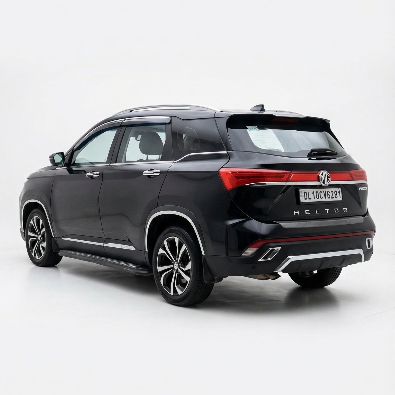 Black SUV with a red accent on a white background