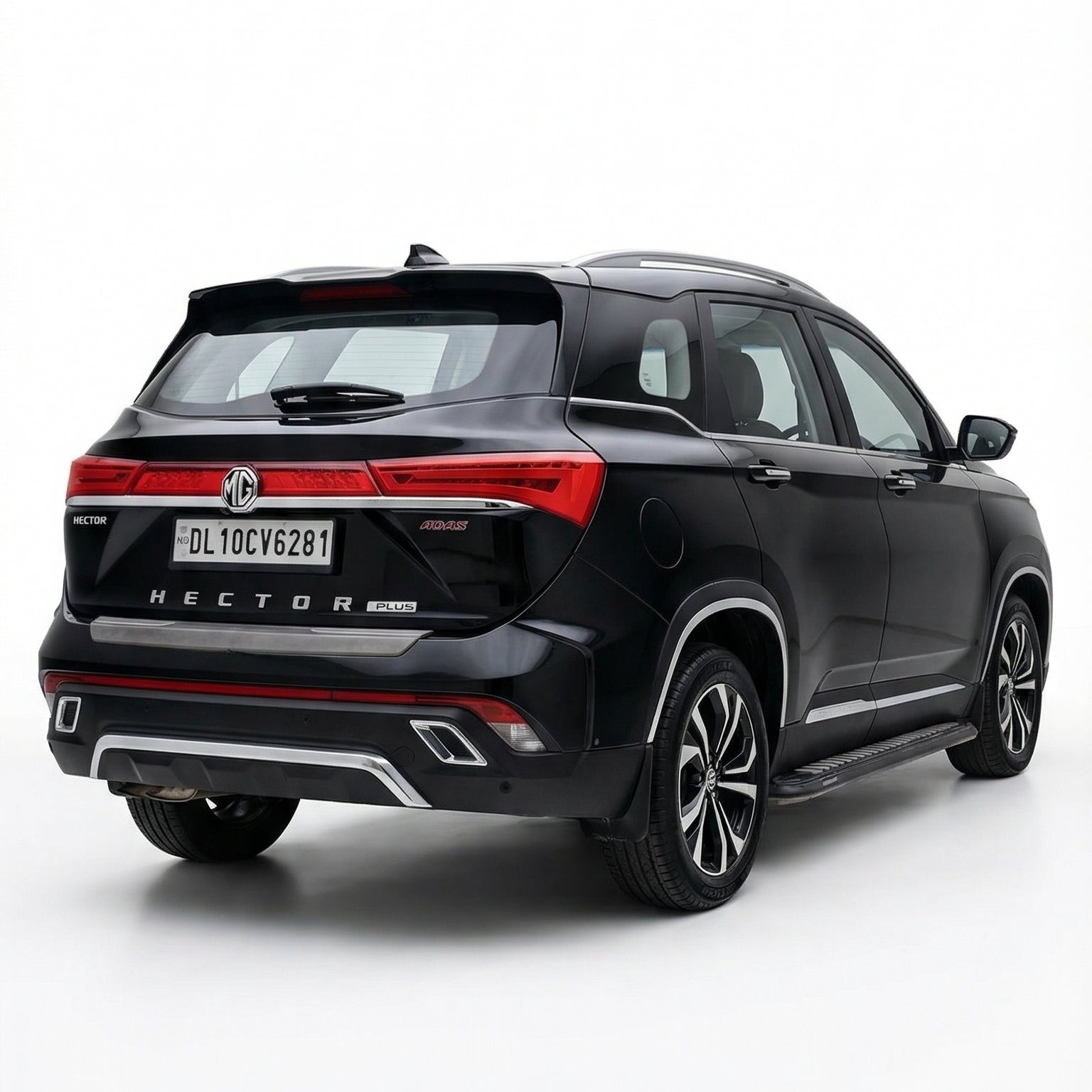 Black SUV with a red accent on a white background