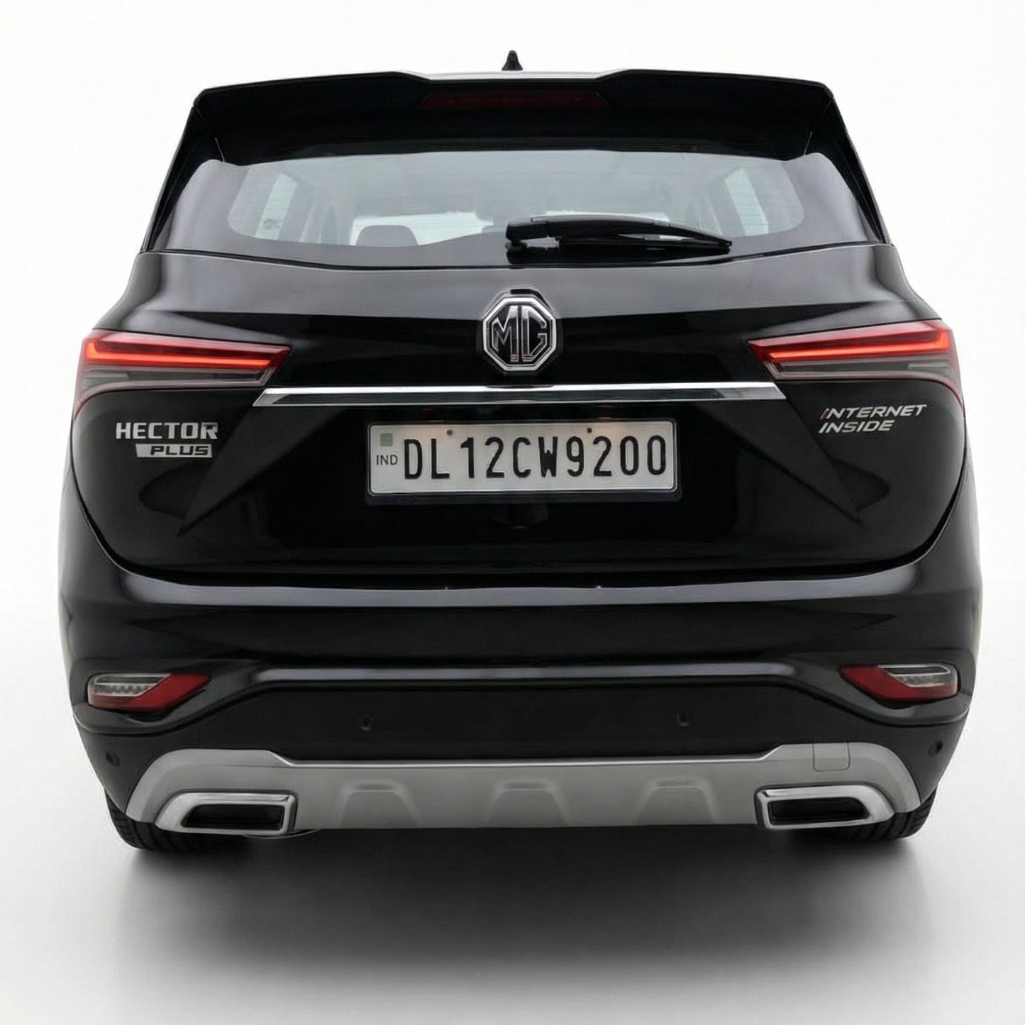 Black SUV with a visible license plate on a white background