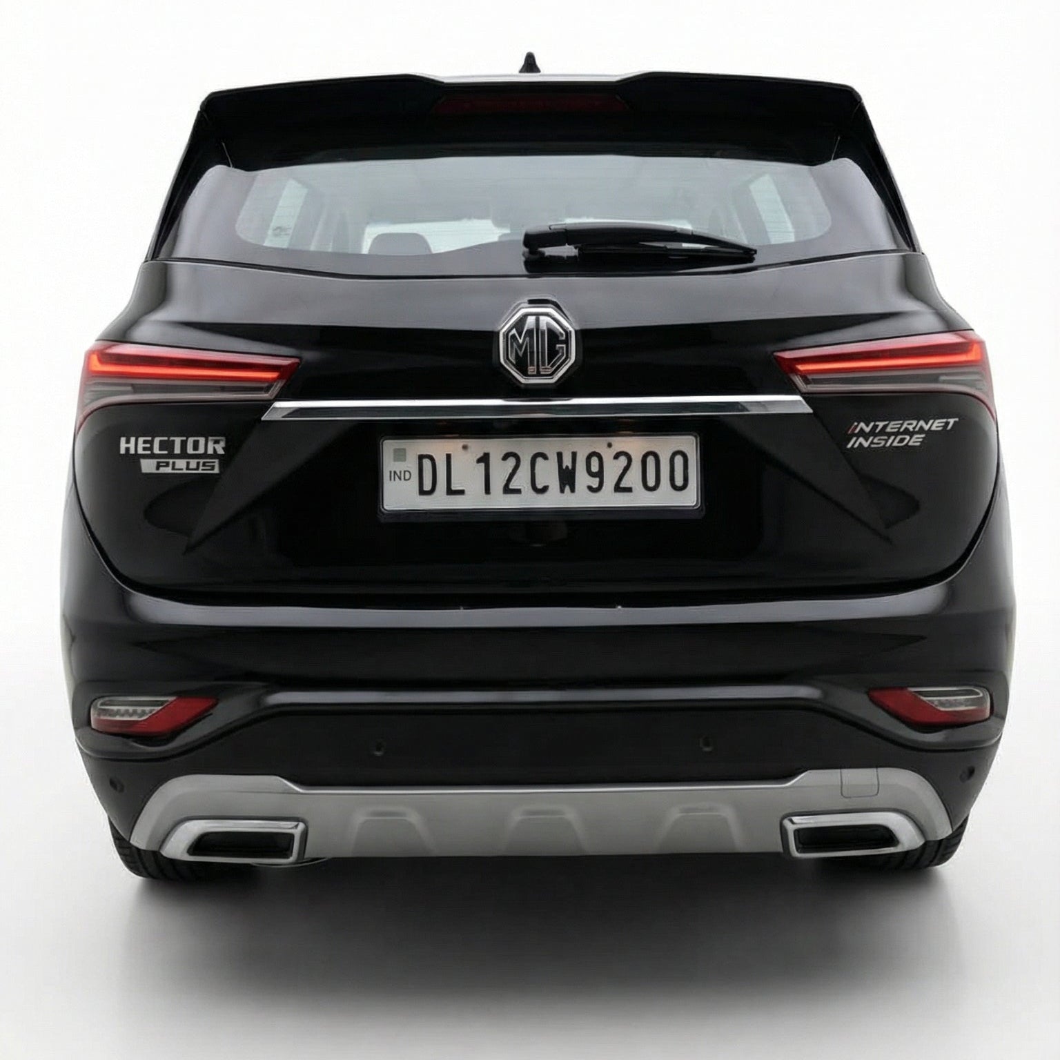 Black SUV with a visible license plate on a white background