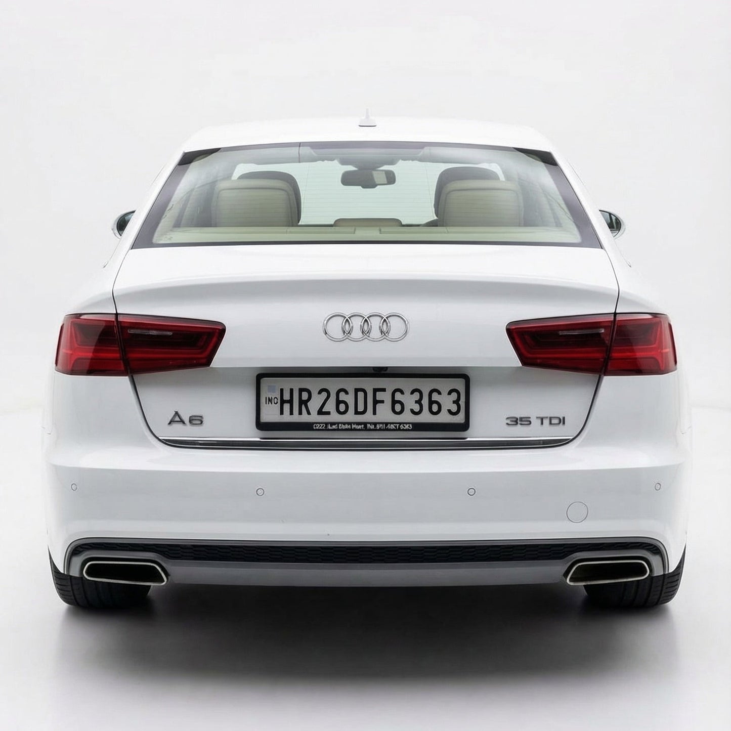 White Audi car shown from the rear on a white background
