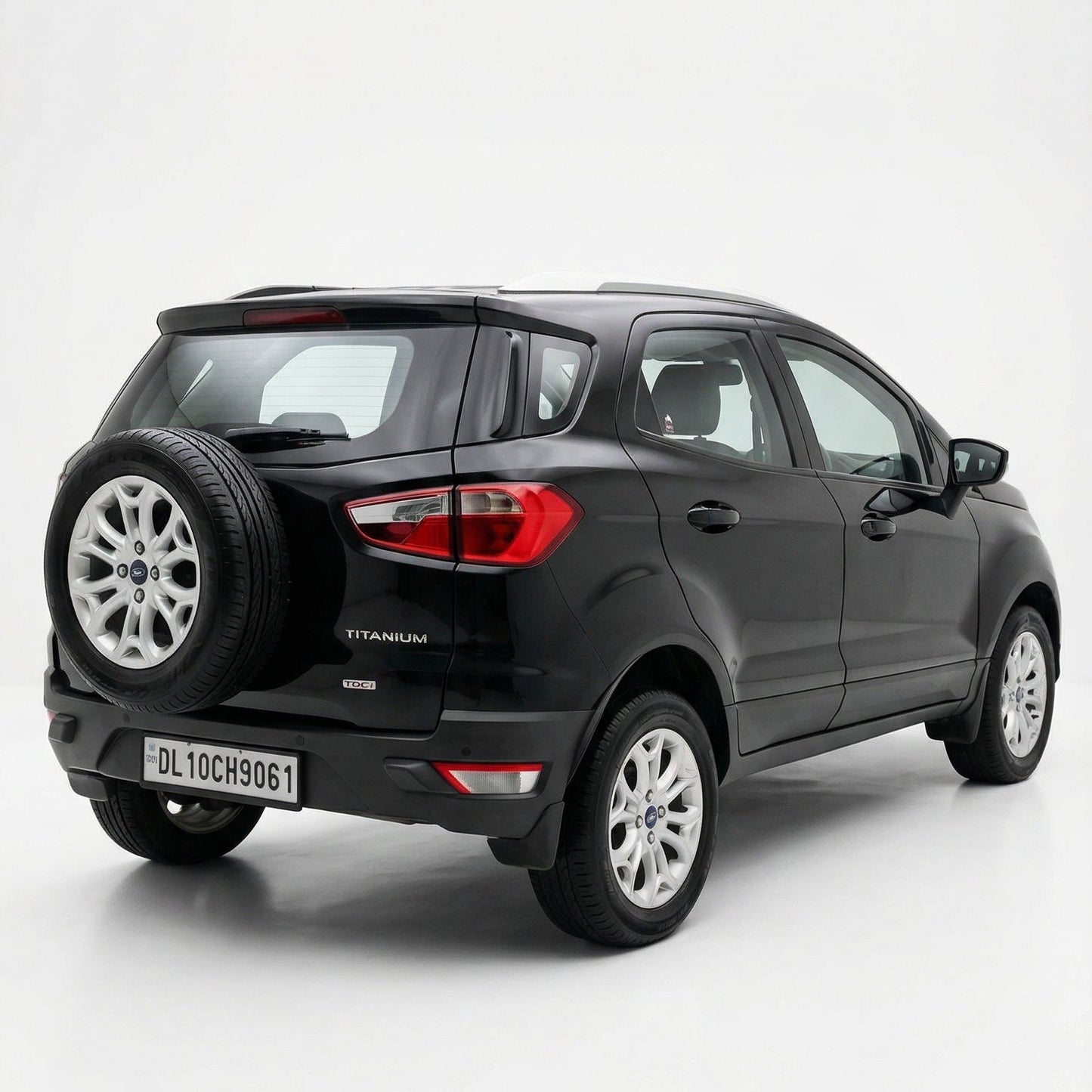 Black SUV with spare tire on a white background