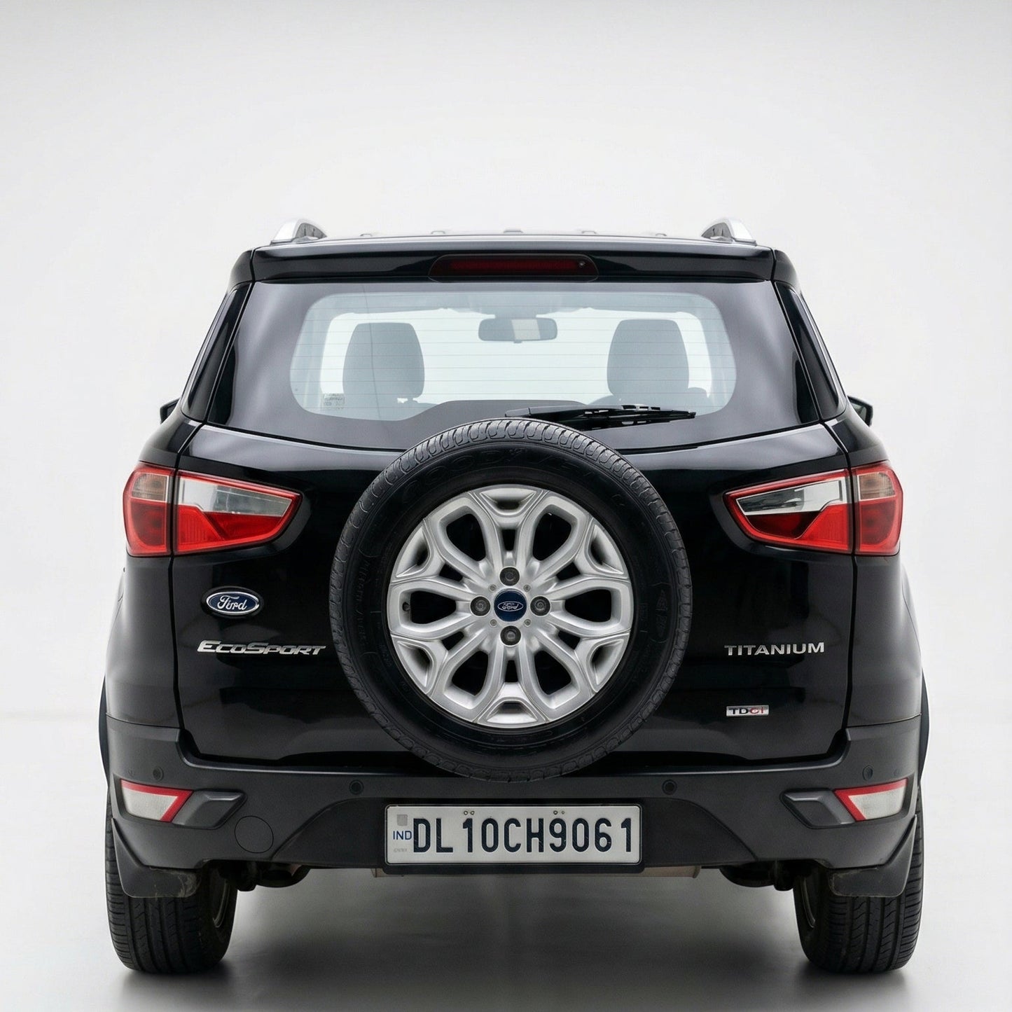 Black Ford Ecosports SUV with spare tire on a white background