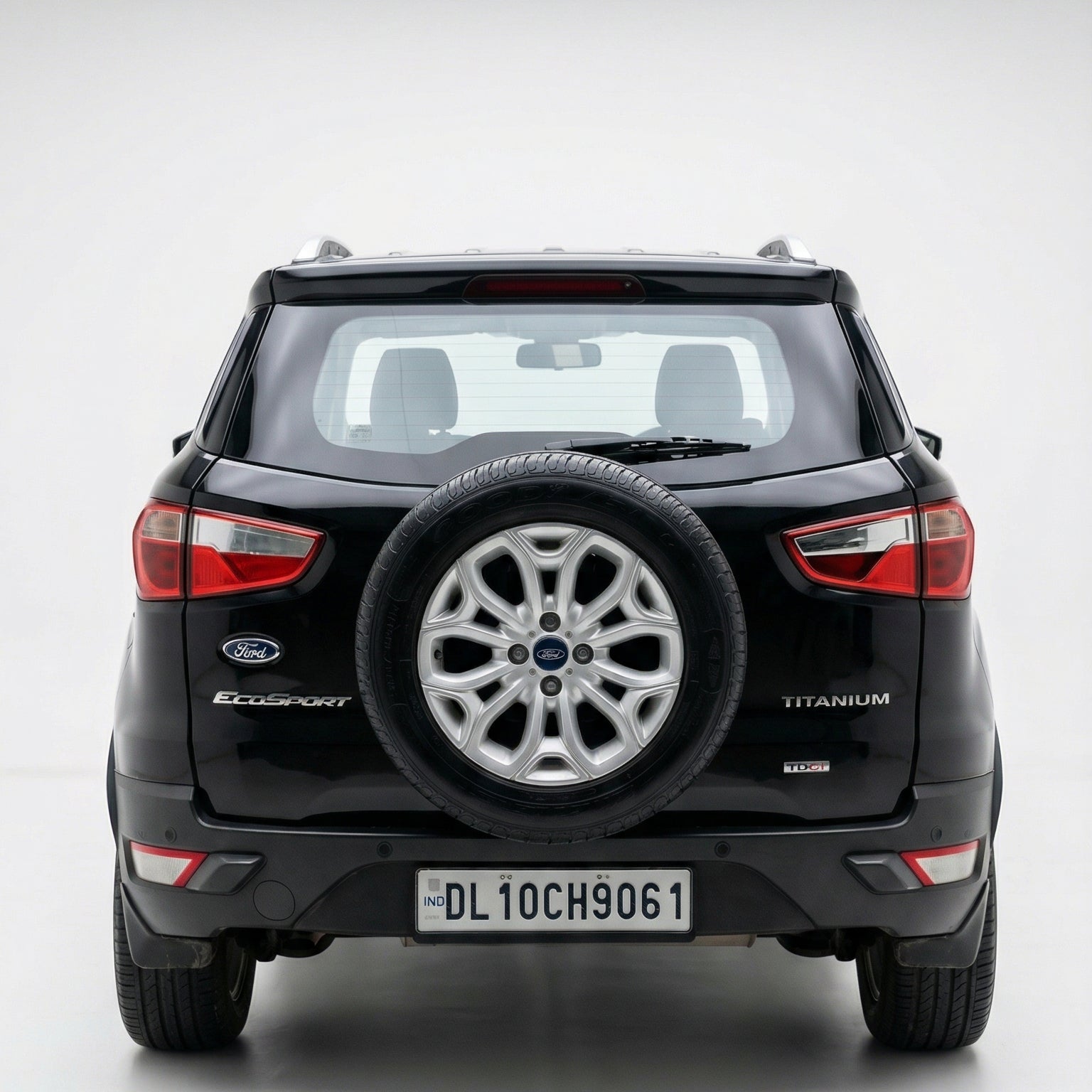 Black Ford Ecosports SUV with spare tire on a white background