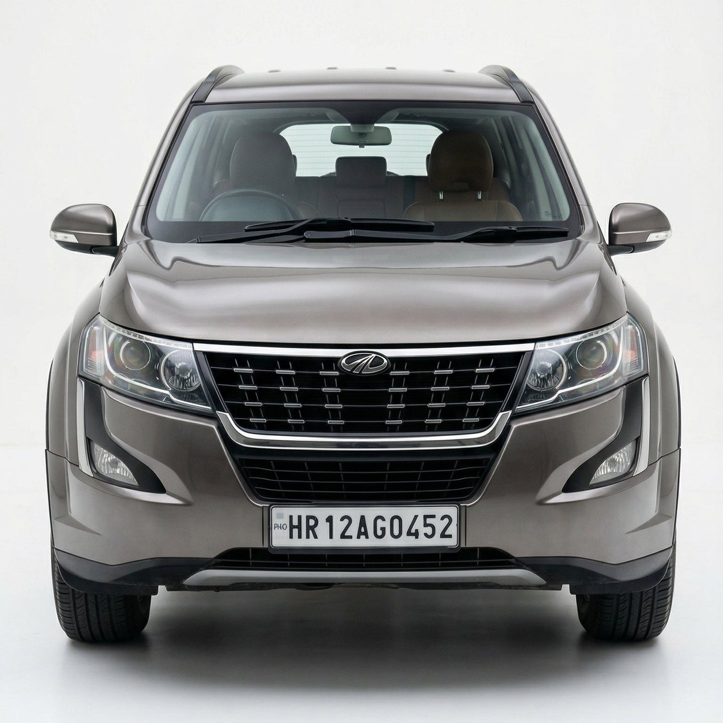 Front view of a gray SUV on a white background