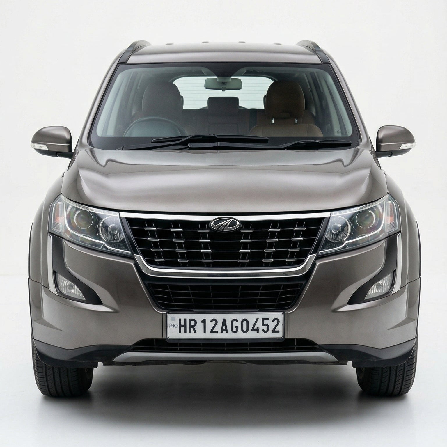 Front view of a gray SUV on a white background