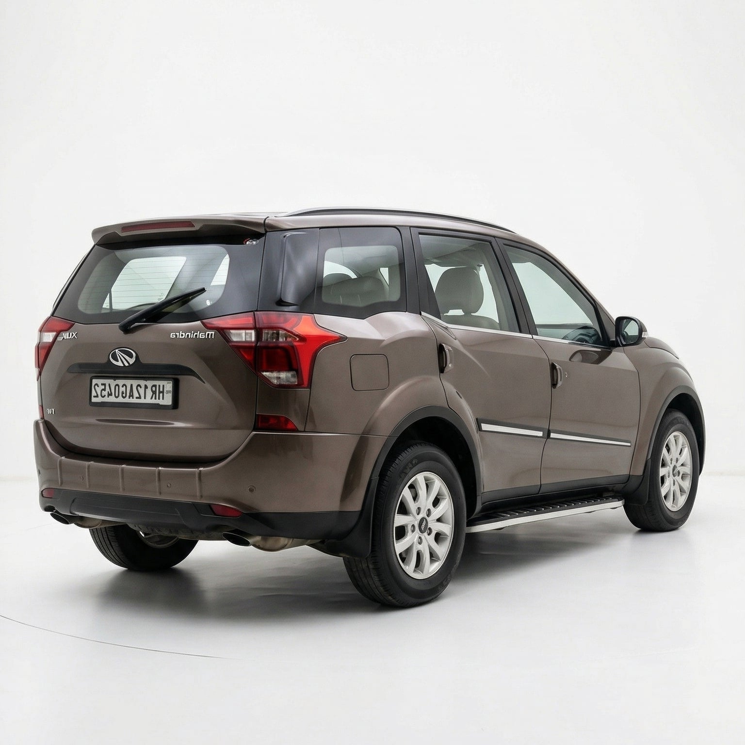 Brown SUV on a white background