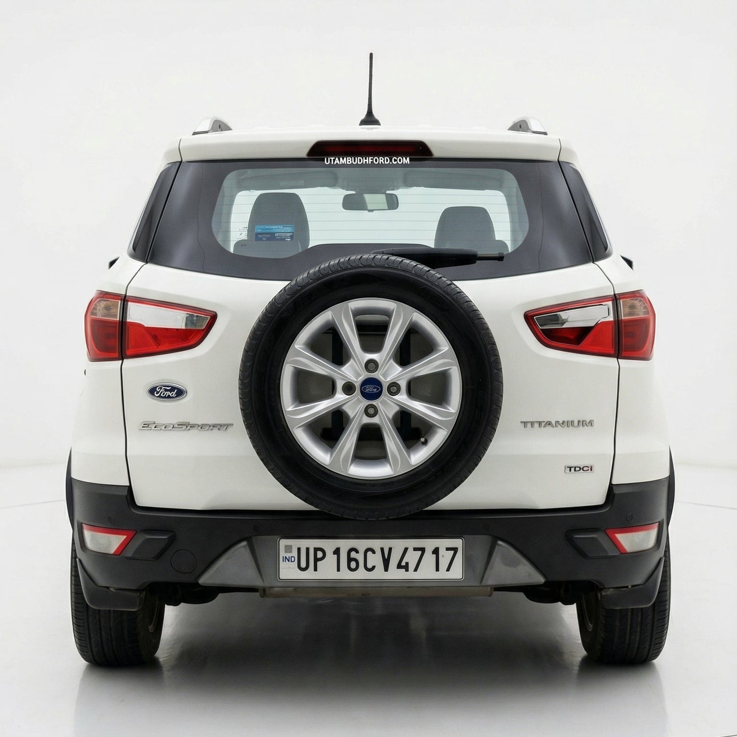 Back view of a white SUV with spare tire on a white background
