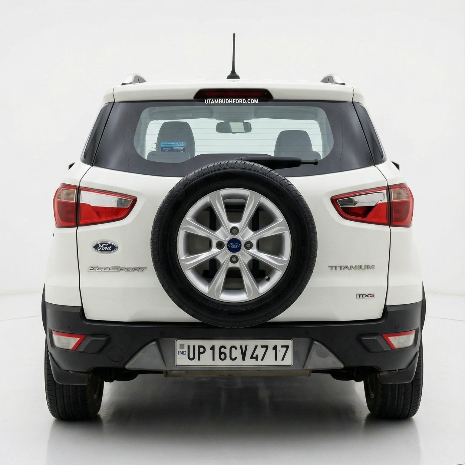 Back view of a white SUV with spare tire on a white background