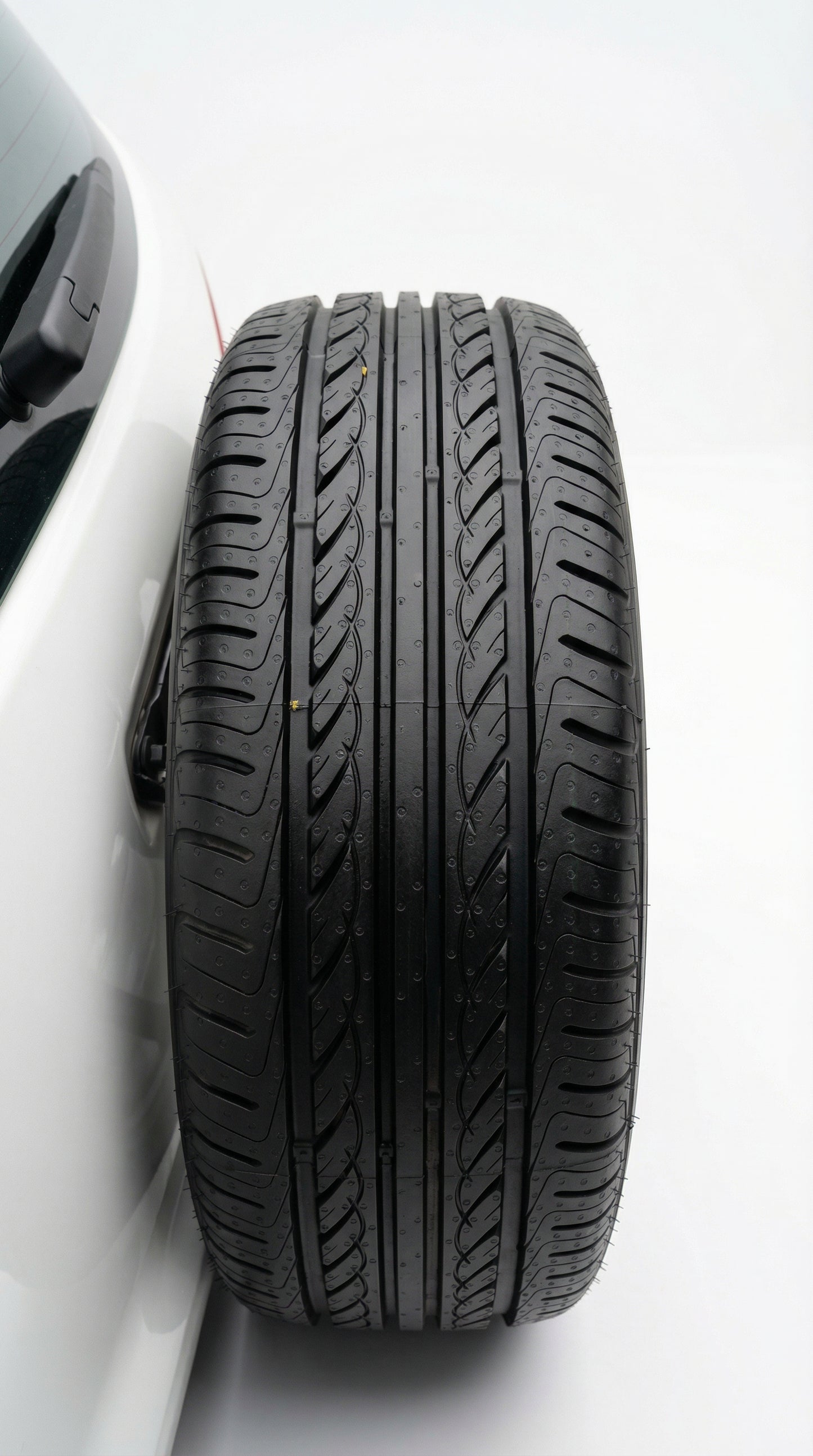 Car tire with white rim on a white background