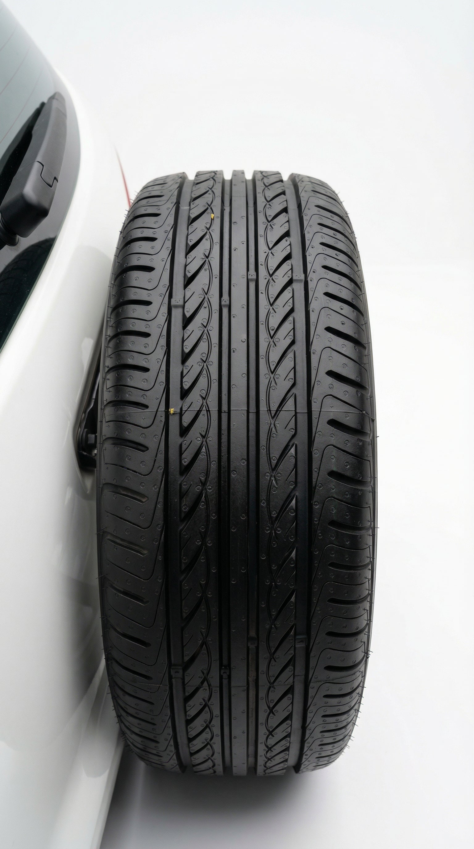 Car tire with white rim on a white background