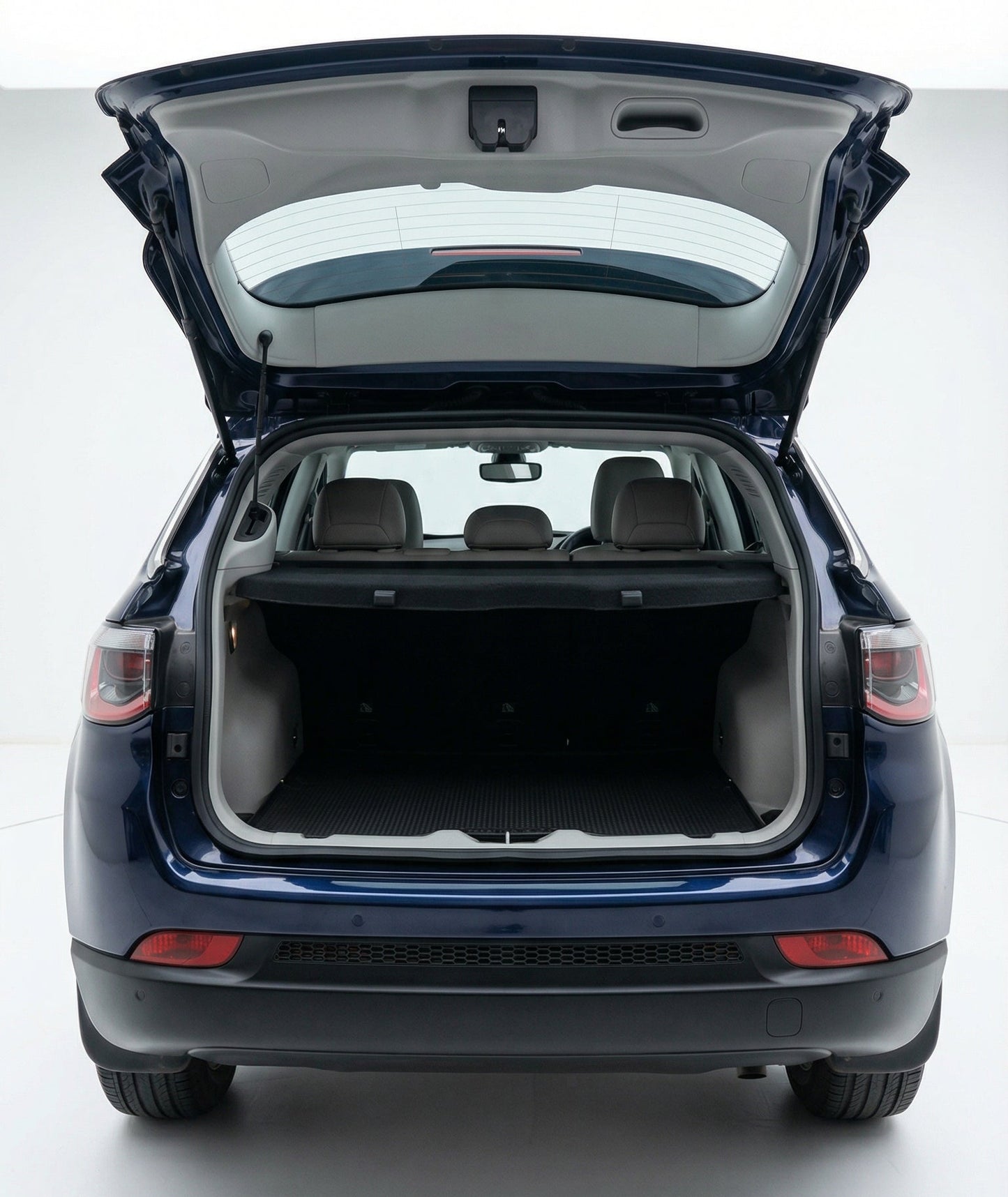 Blue car with open trunk on a white background