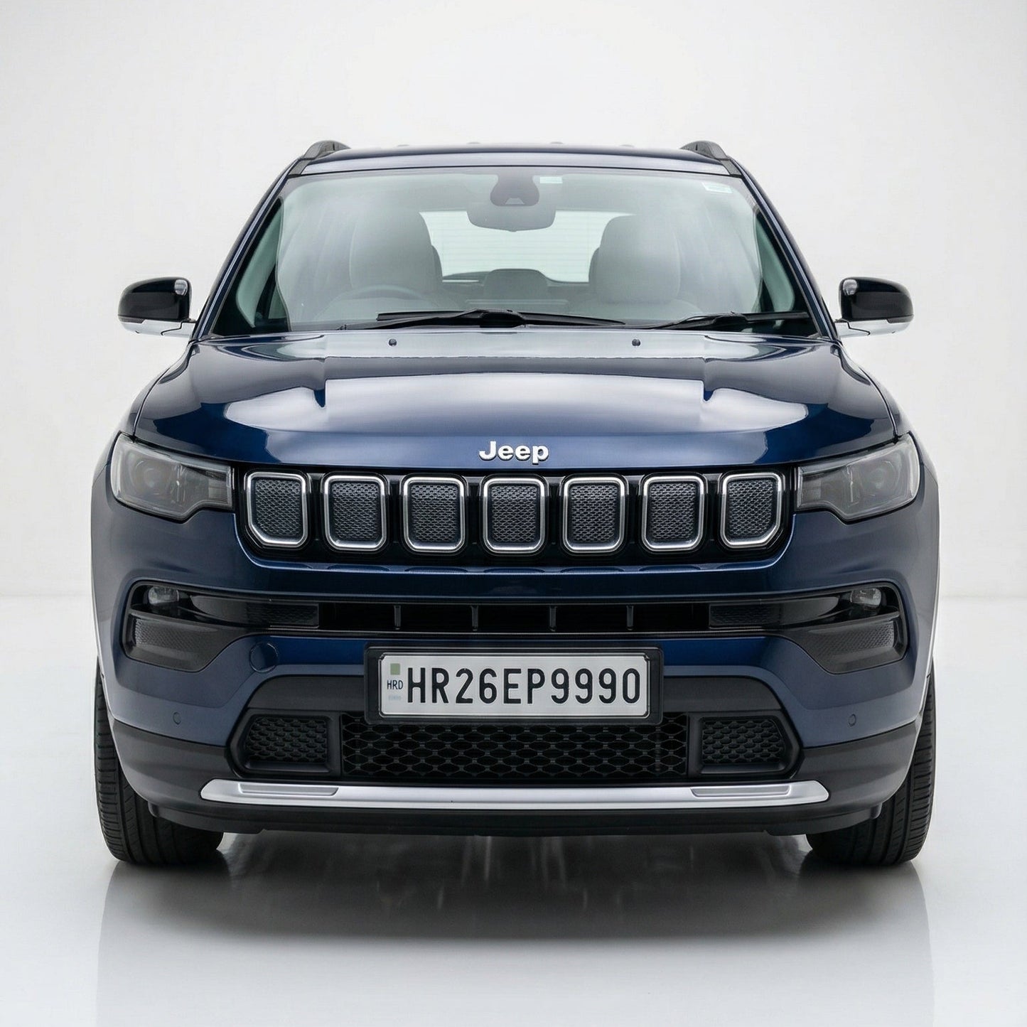 Blue Jeep SUV on a white background