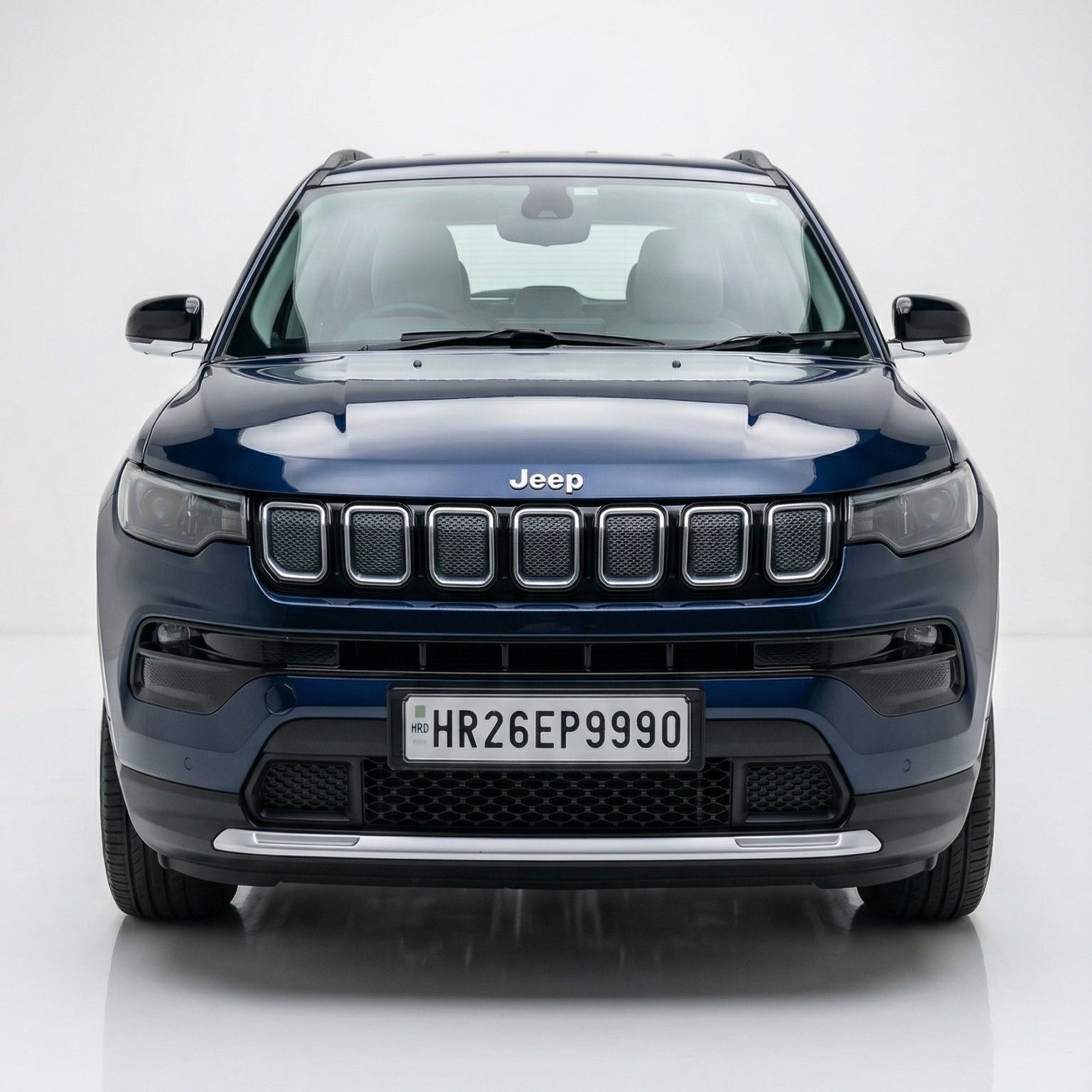 Blue Jeep SUV on a white background