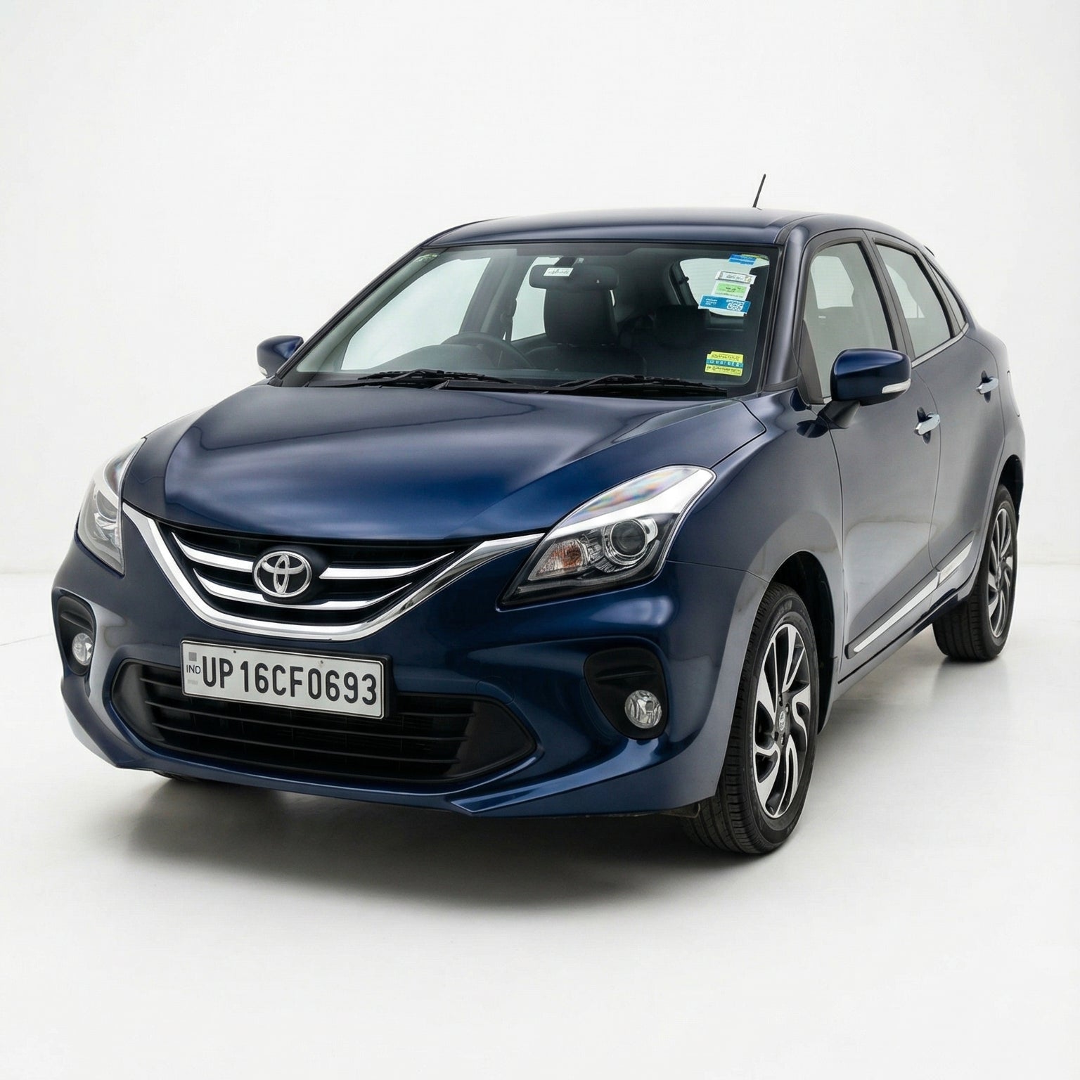 Blue Toyota car on a white background