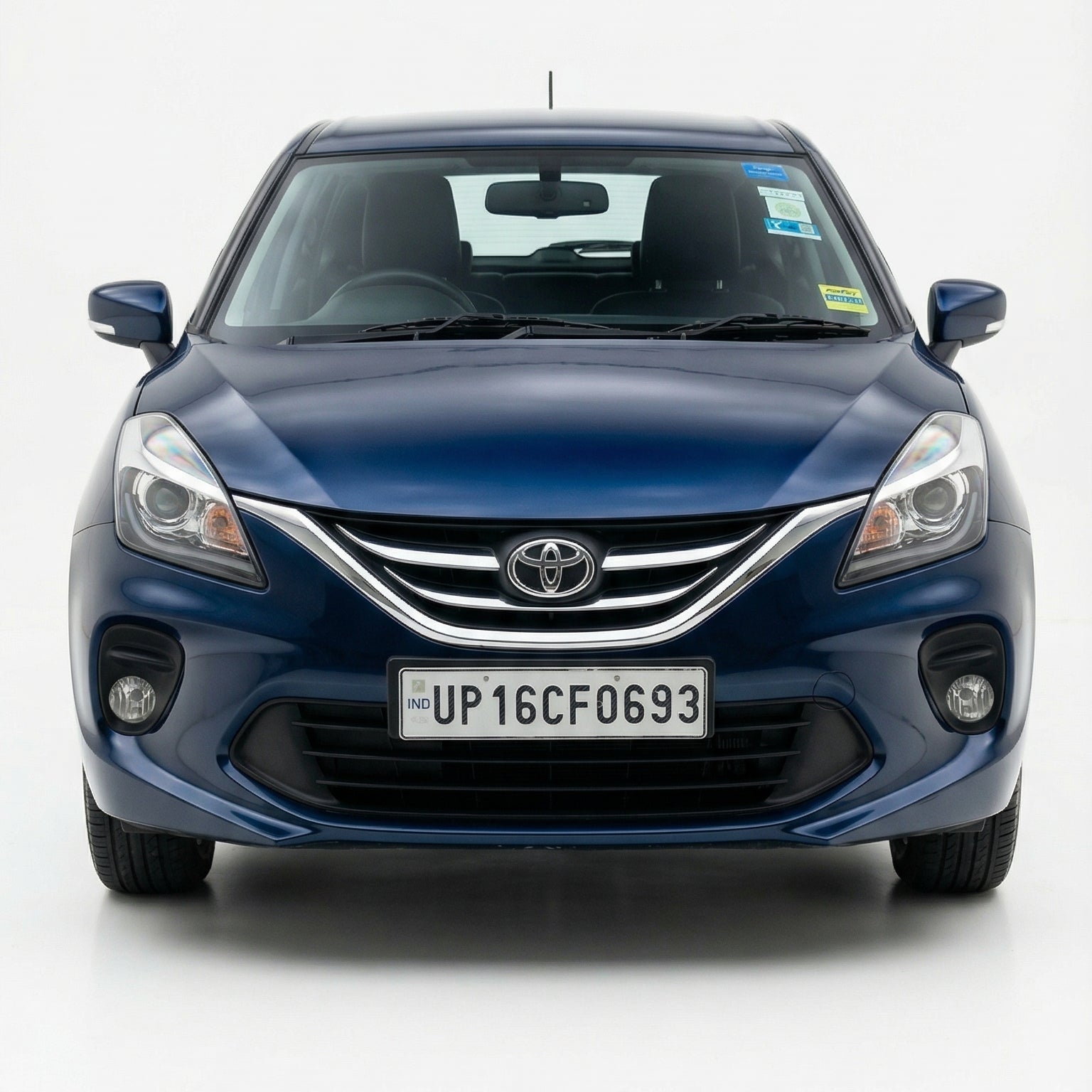 Blue Toyota car on a white background