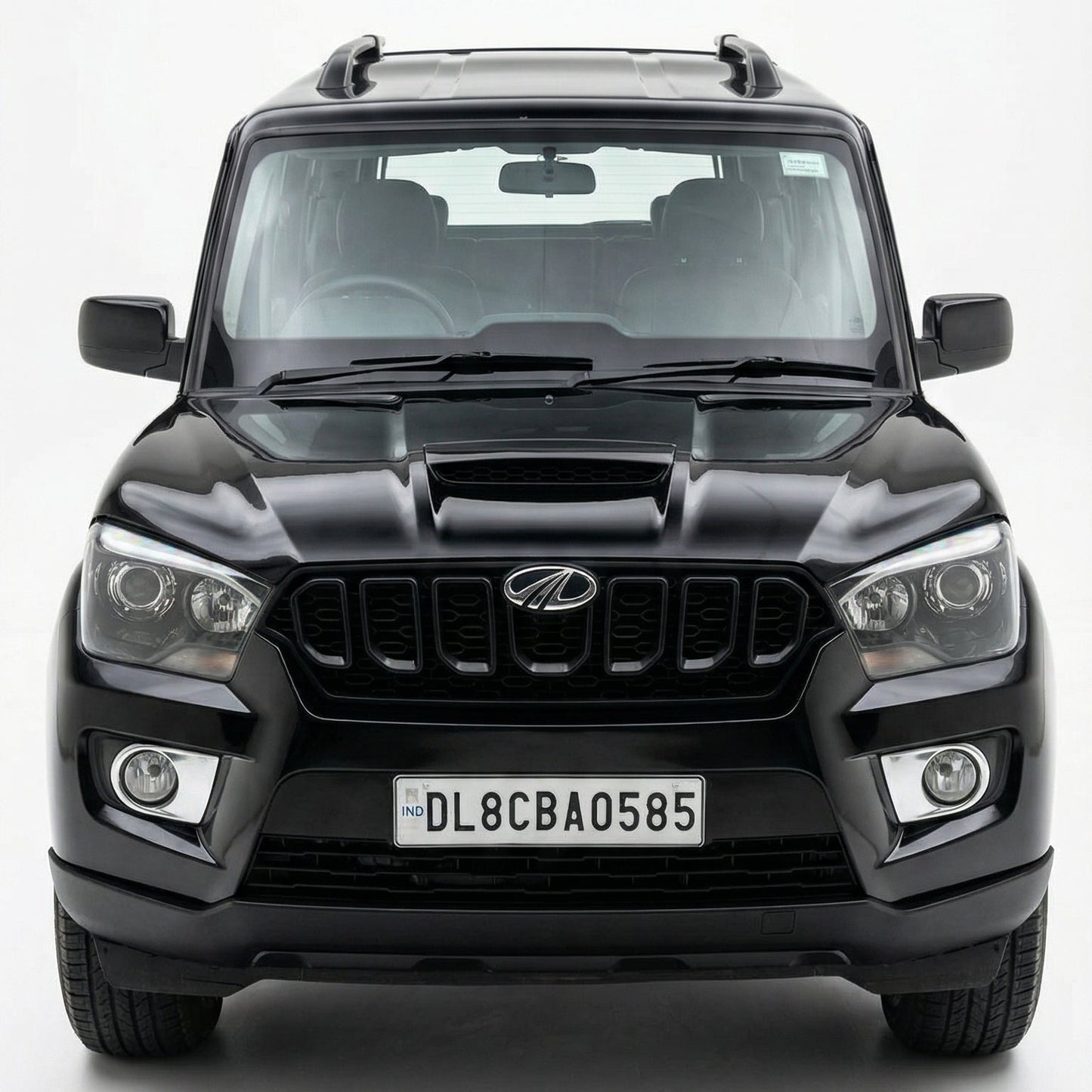 Black SUV with a visible license plate on a white background