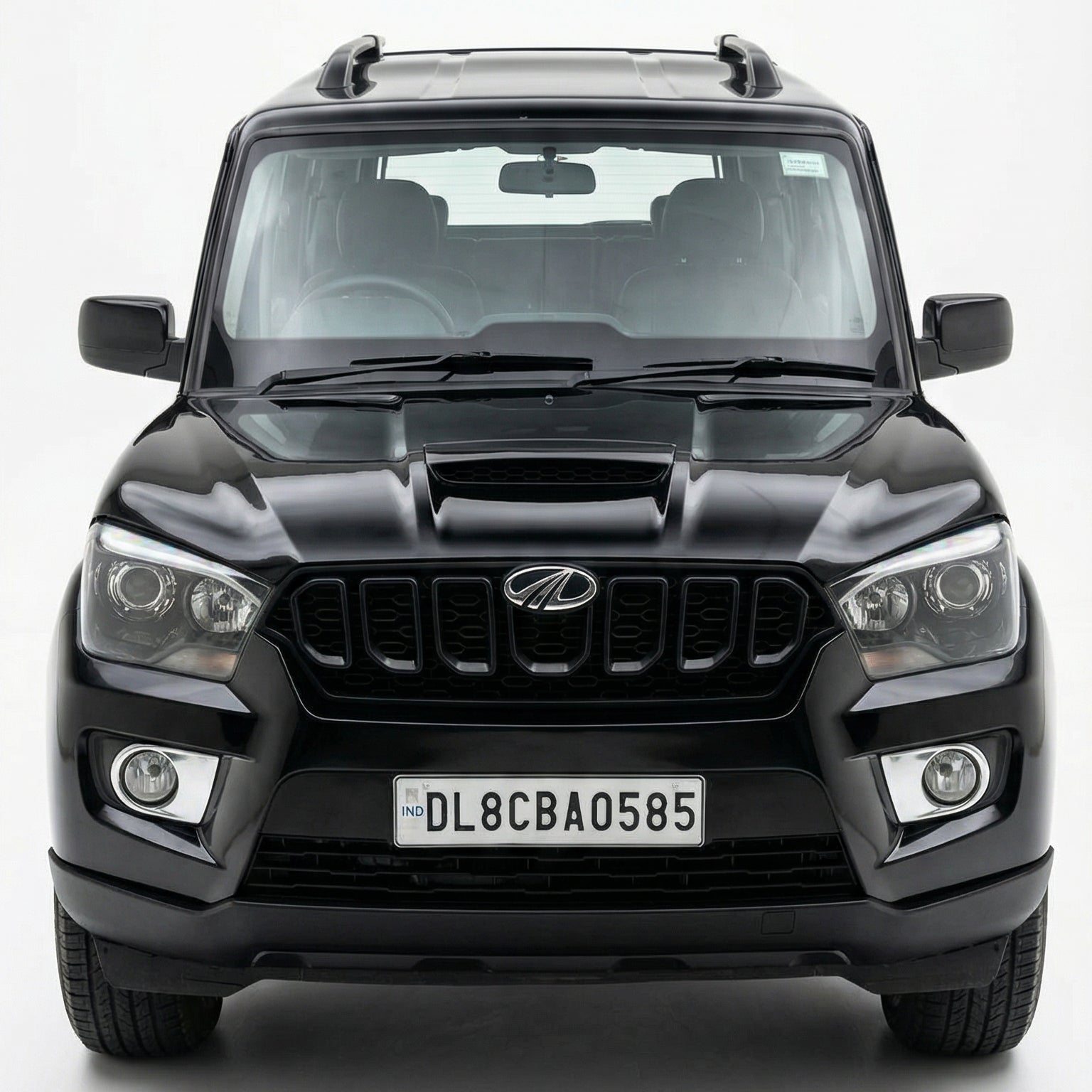 Black SUV with a visible license plate on a white background