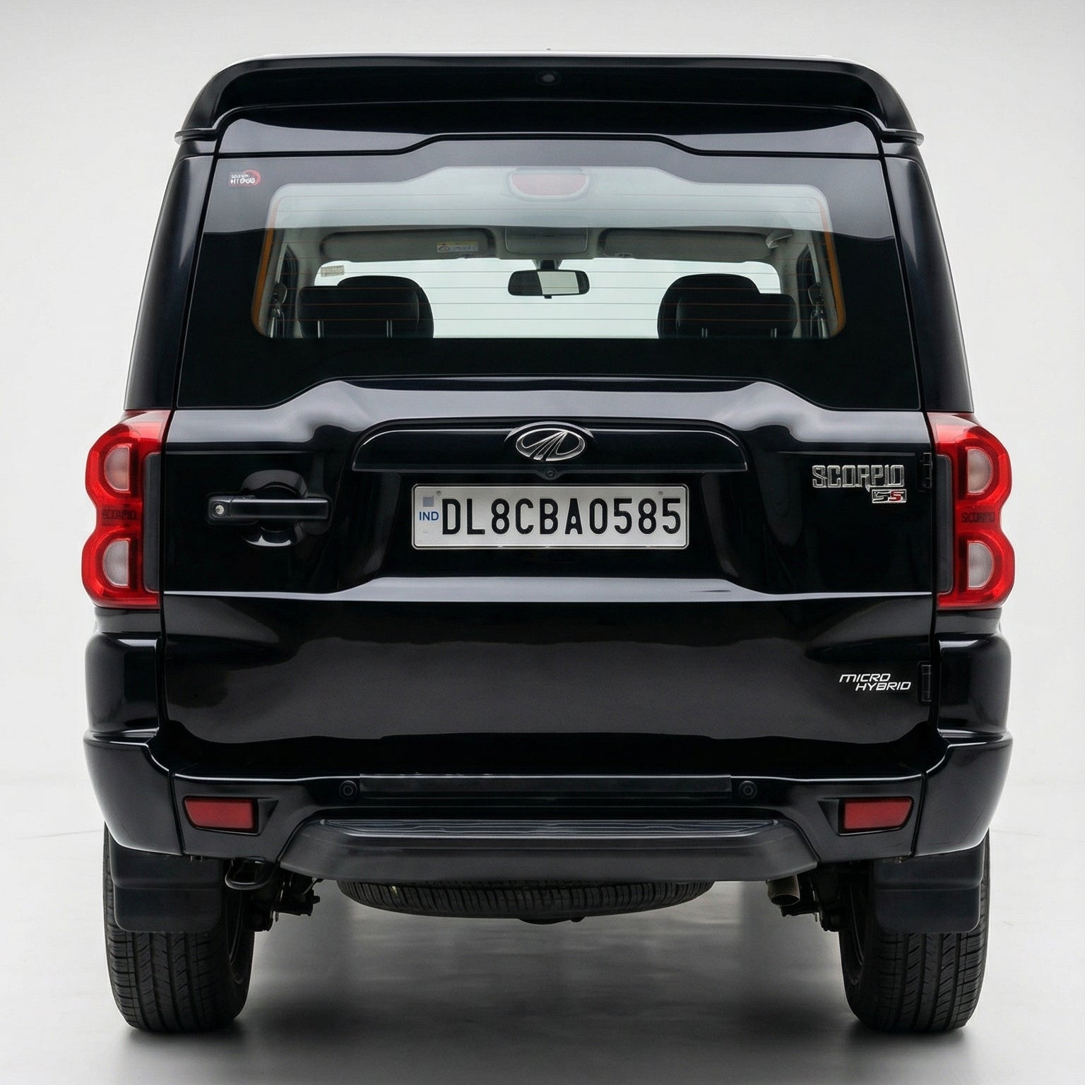 Black SUV with a visible license plate on a white background