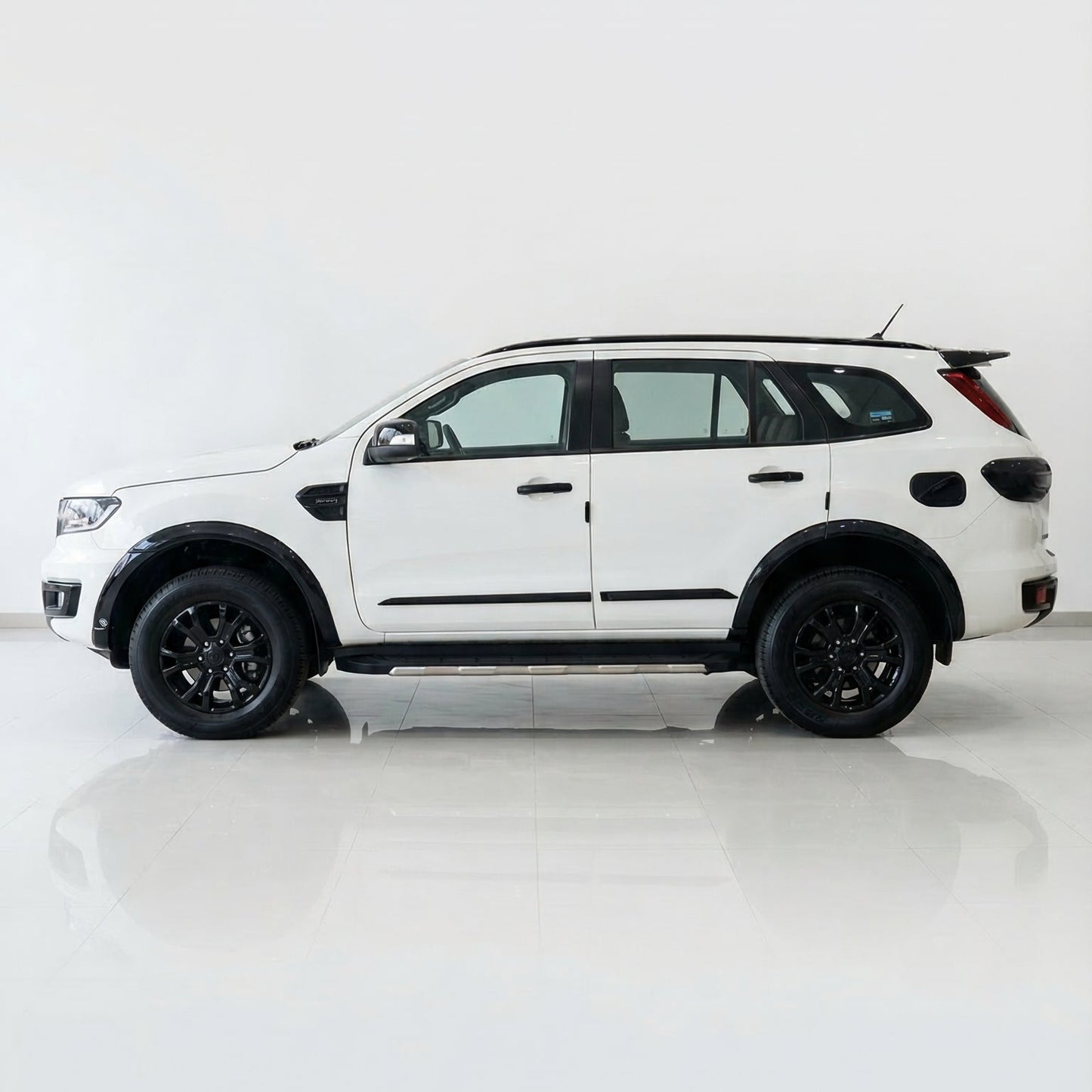 White SUV with black accents on a white background