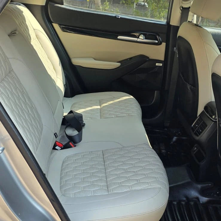 Car interior with beige seat cover and open door