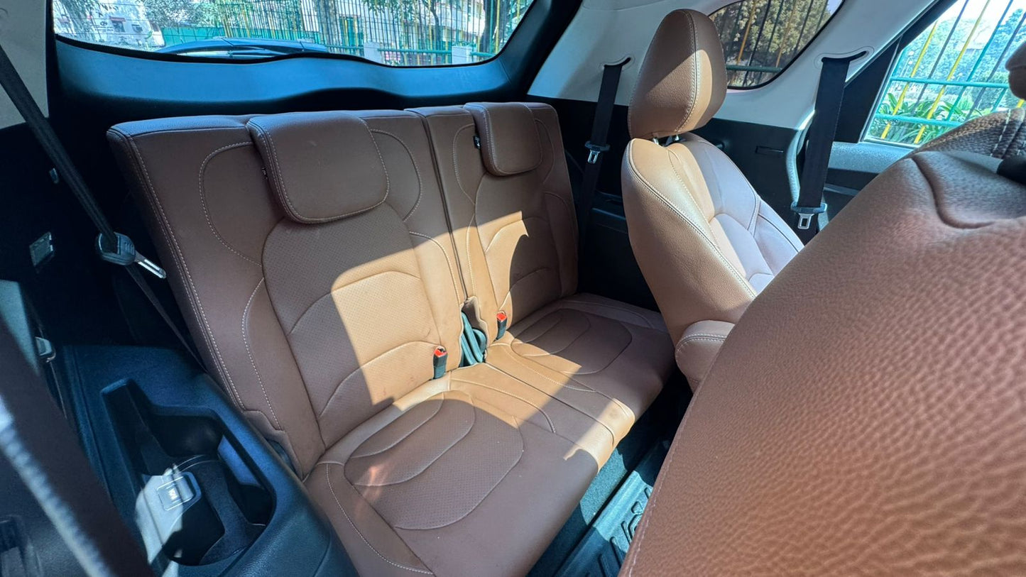 Beige interior of a car with sunlit seats