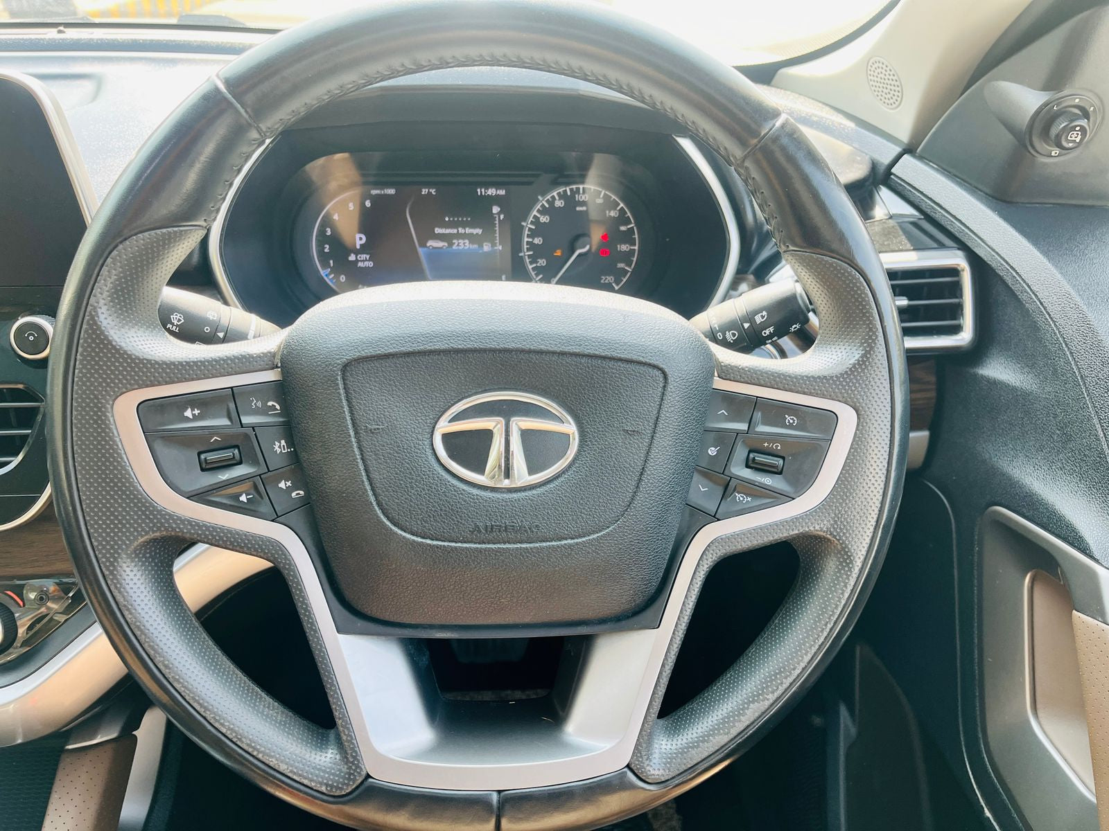 Steering wheel with Tata logo in a car interior
