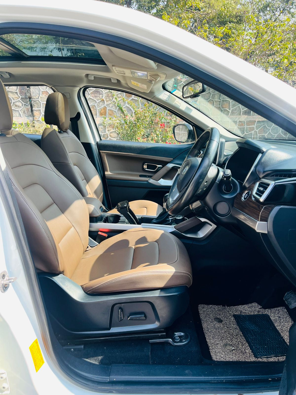 Car interior with beige seats and dashboard view
