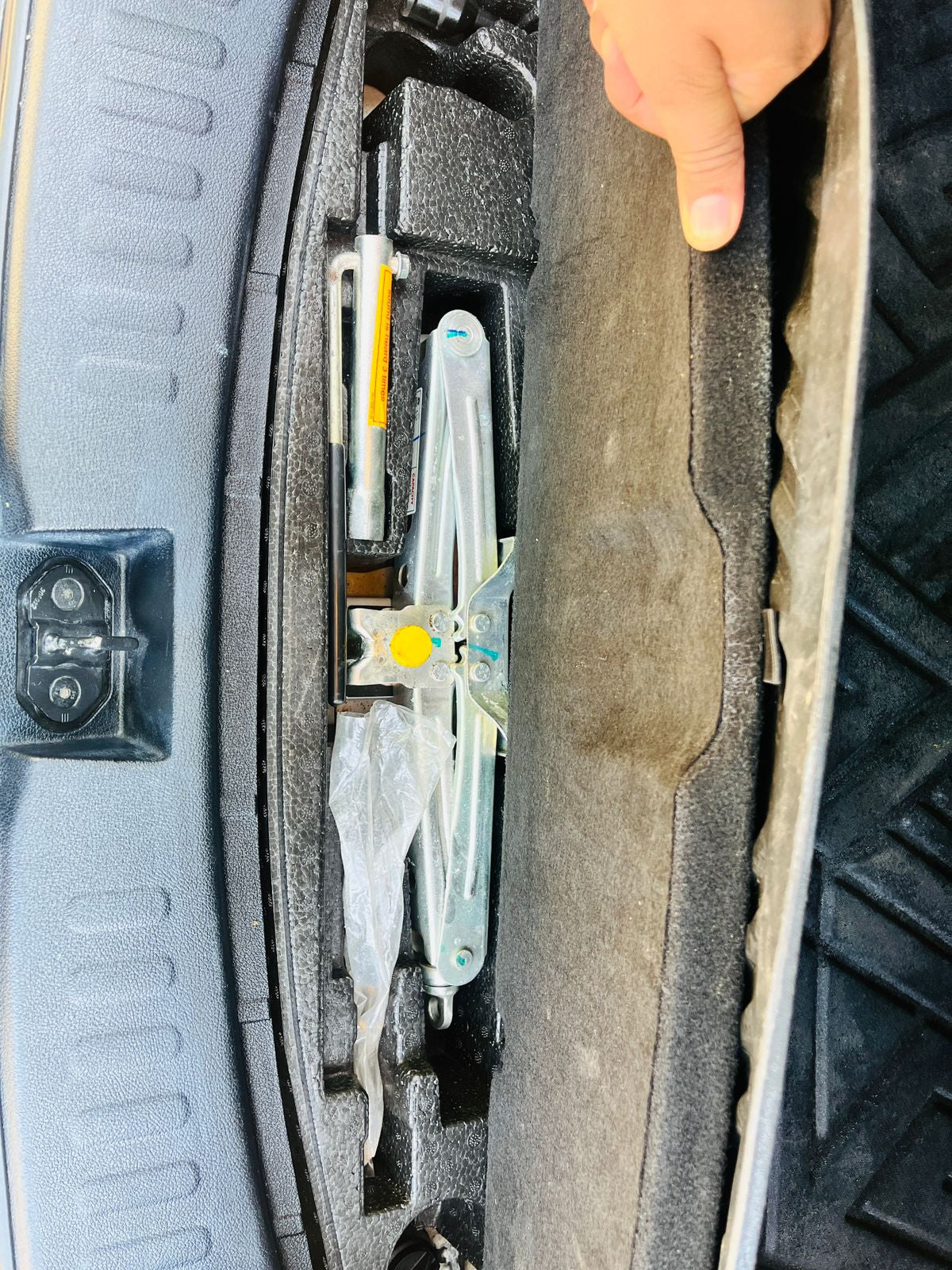 Car tire with a tool kit inside, showing a close-up of the tire's inner structure.
