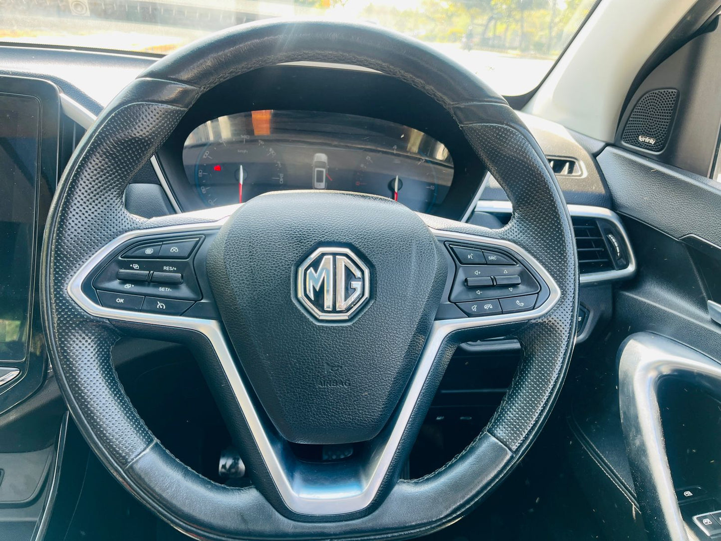 Steering wheel with MG logo in a car interior