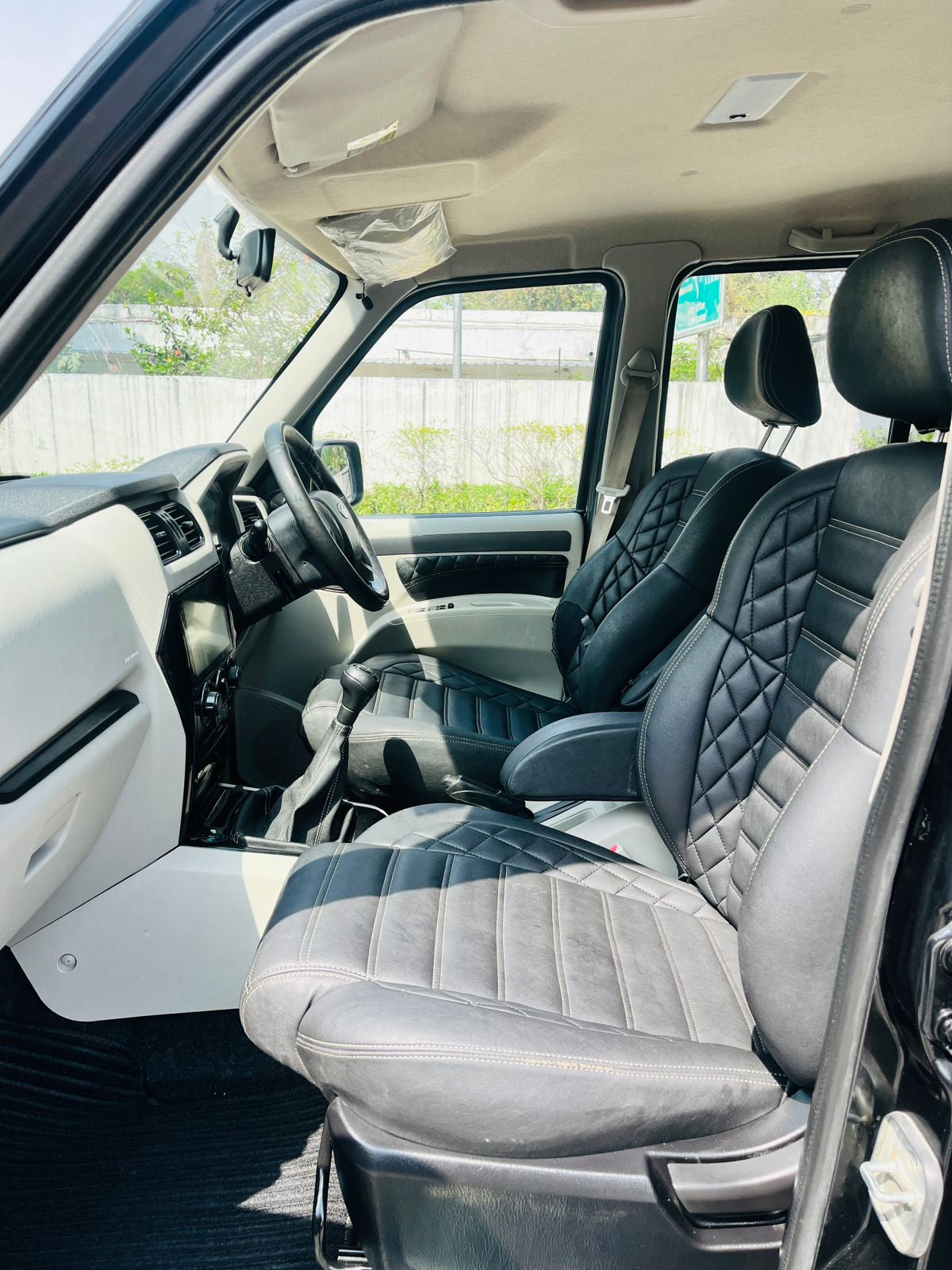Car interior with black and gray quilted seats