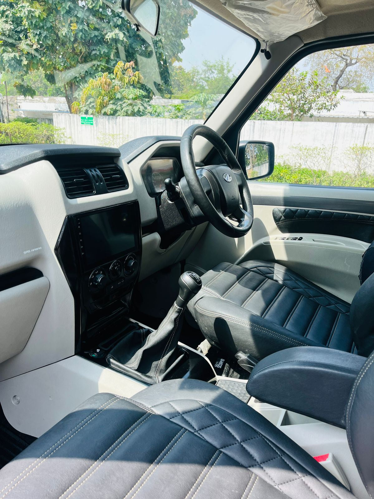 Car interior with steering wheel and dashboard view