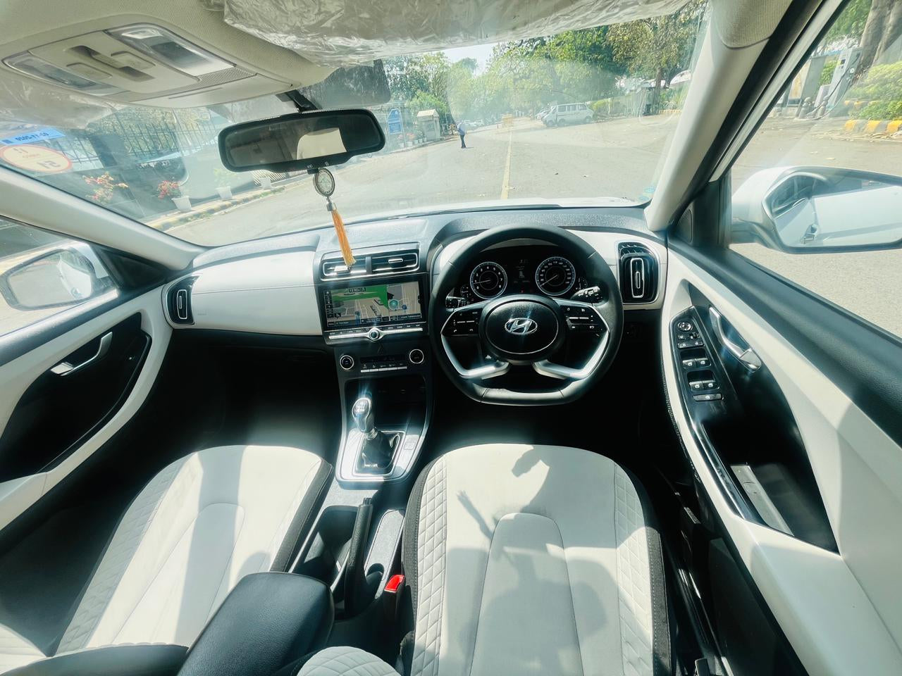 Car interior with dashboard and steering wheel view